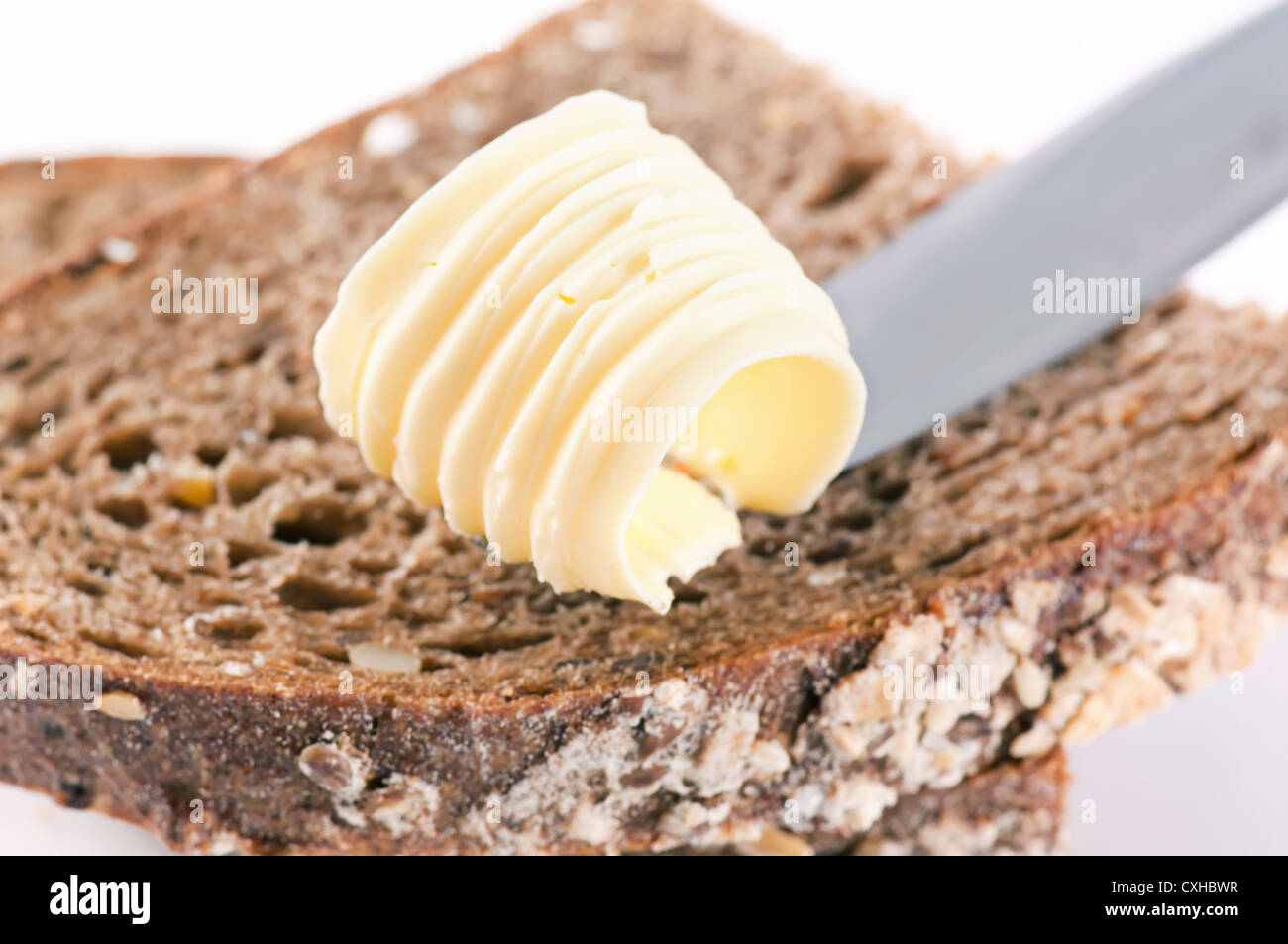 Stück Brot mit Butter rollt Stockfoto