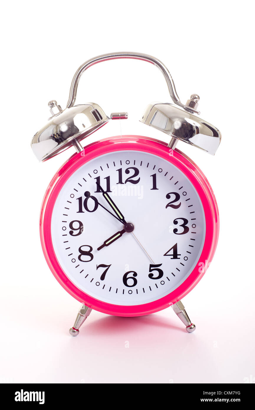 Rosa Wecker auf weißem Hintergrund Stockfoto