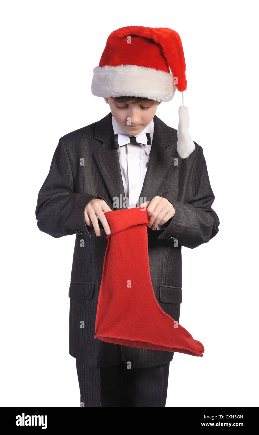 Junge mit rotem Hut und rote Socke, isoliert auf einem weißen Hintergrund. Stockfoto