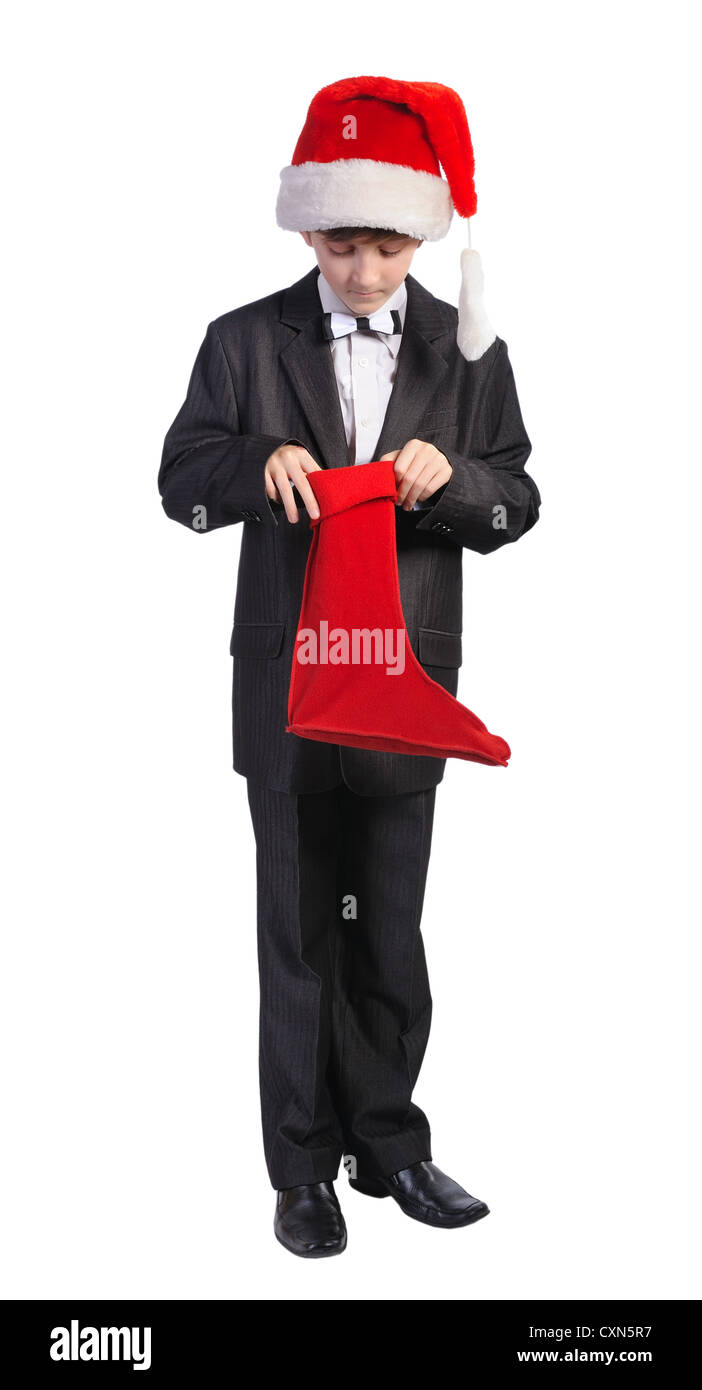 Junge mit rotem Hut und rote Socke, isoliert auf einem weißen Hintergrund. Stockfoto