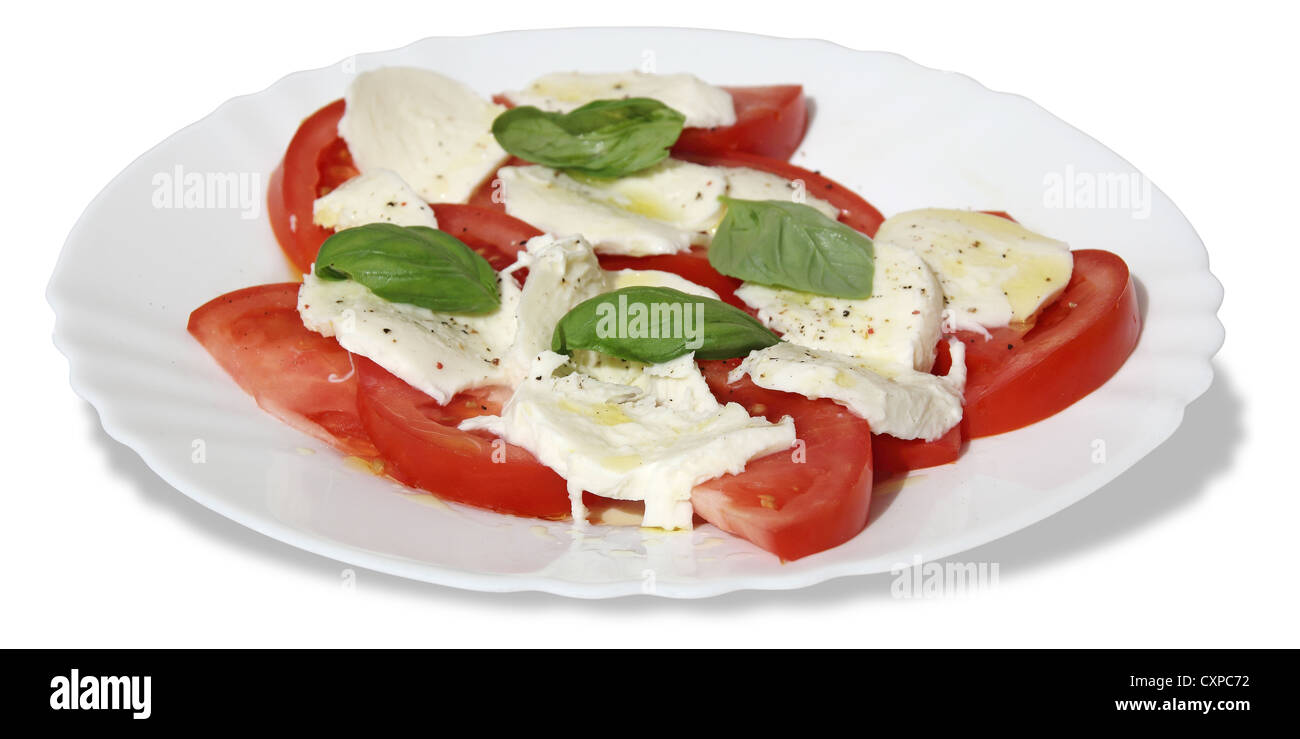 Frische und leckere Tomaten, Basilikum, Mozzarella und Olivenöl Stockfoto