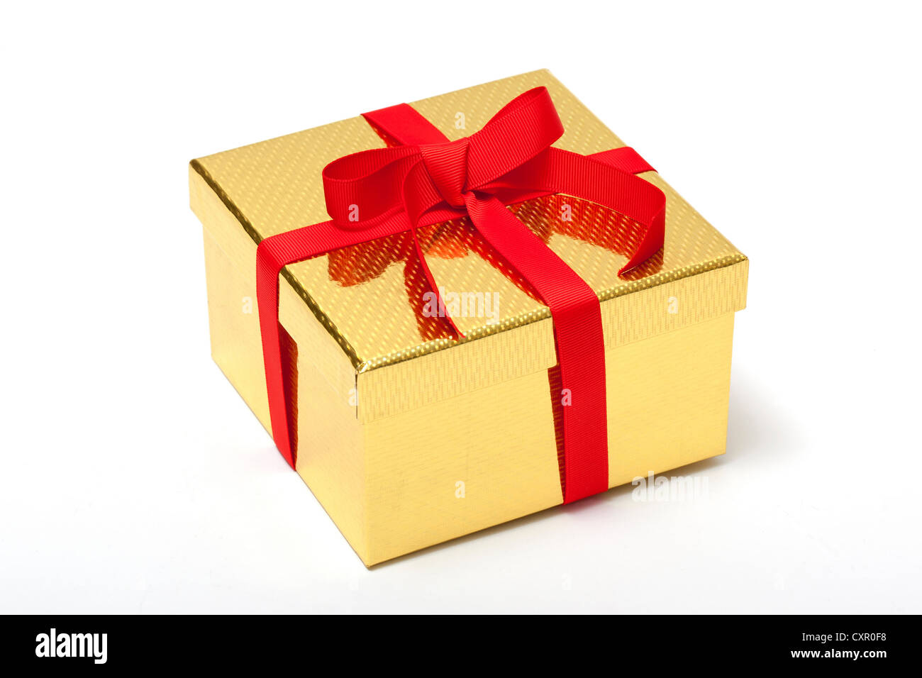 Goldenen Geschenkbox mit rotem Band Stockfoto