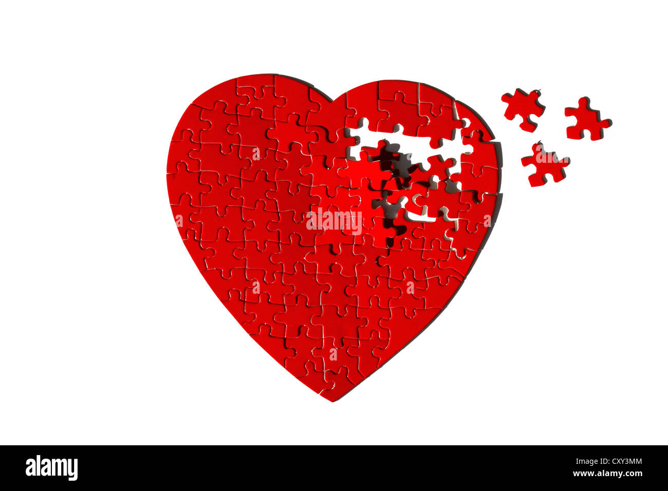 Roten herzförmigen Jigsaw Puzzle, unvollständig Stockfoto