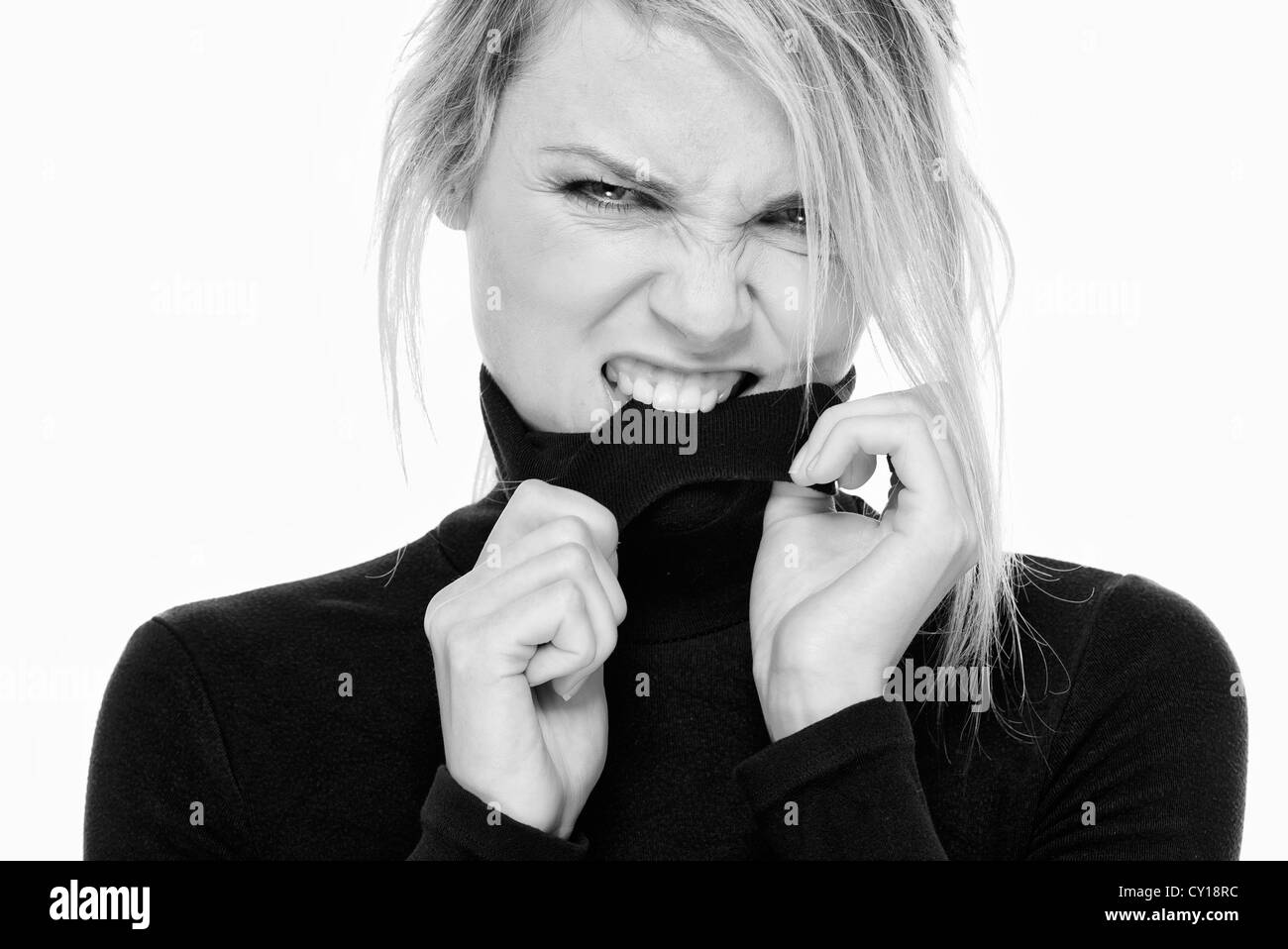 Frau beißende Rollkragen Pullover flirten Stockfoto