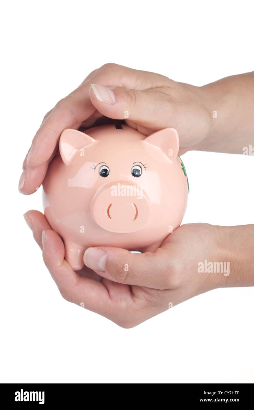 Geld in ein Sparschwein zu schützen Stockfoto