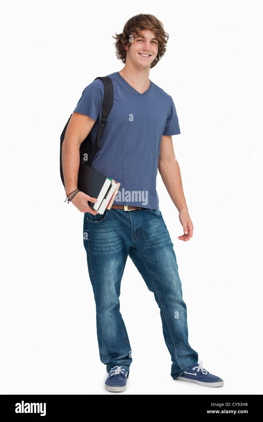 Porträt eines männlichen Studenten mit einem Rucksack mit Büchern Stockfoto