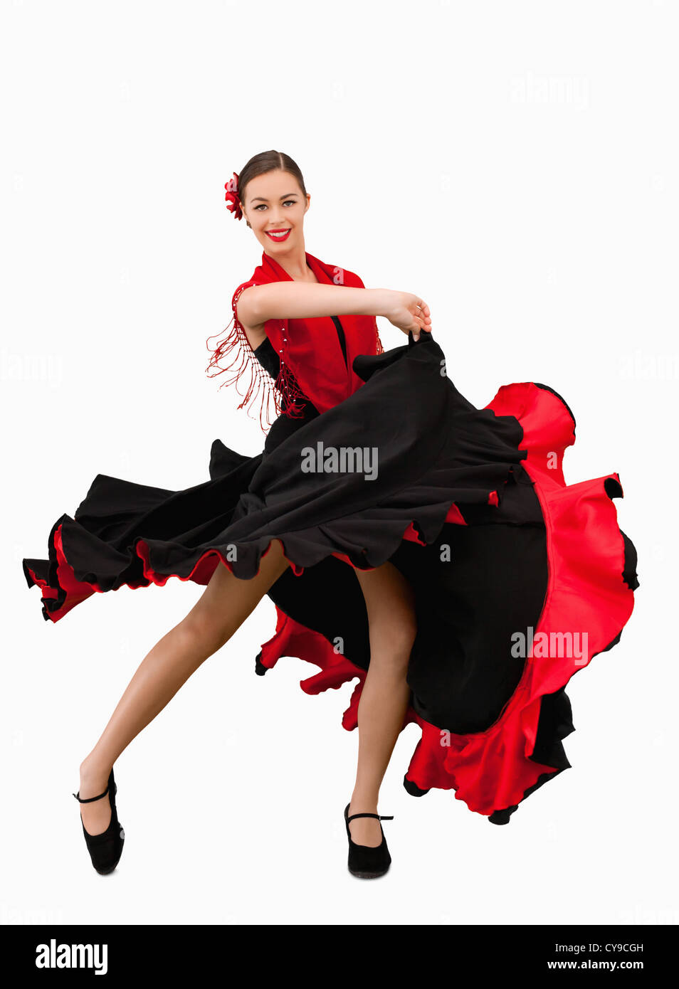 Tanzende Frau in einem roten und schwarzen Kleid Stockfoto