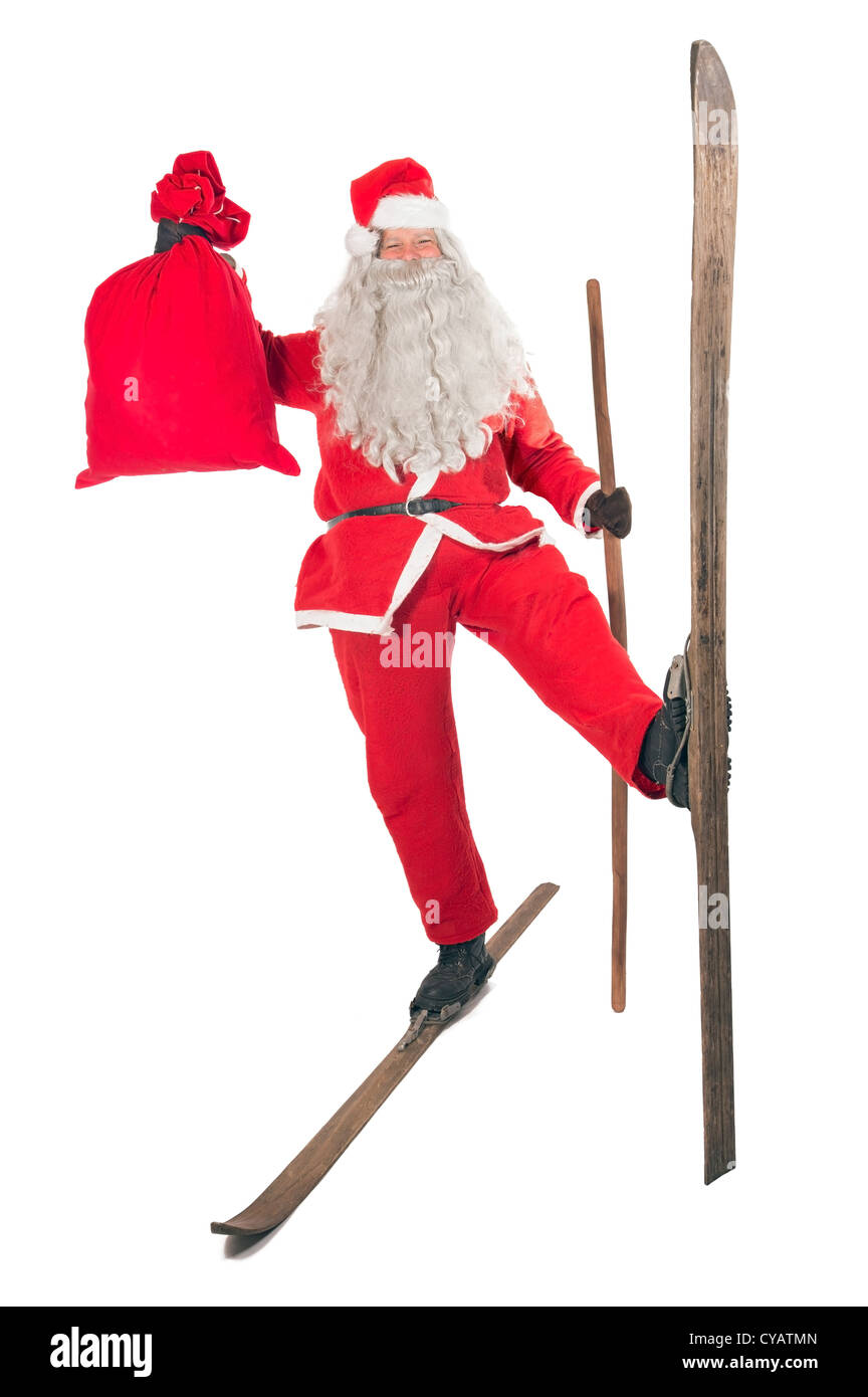 Santa Claus mit Tasche auf Skiern Stockfoto