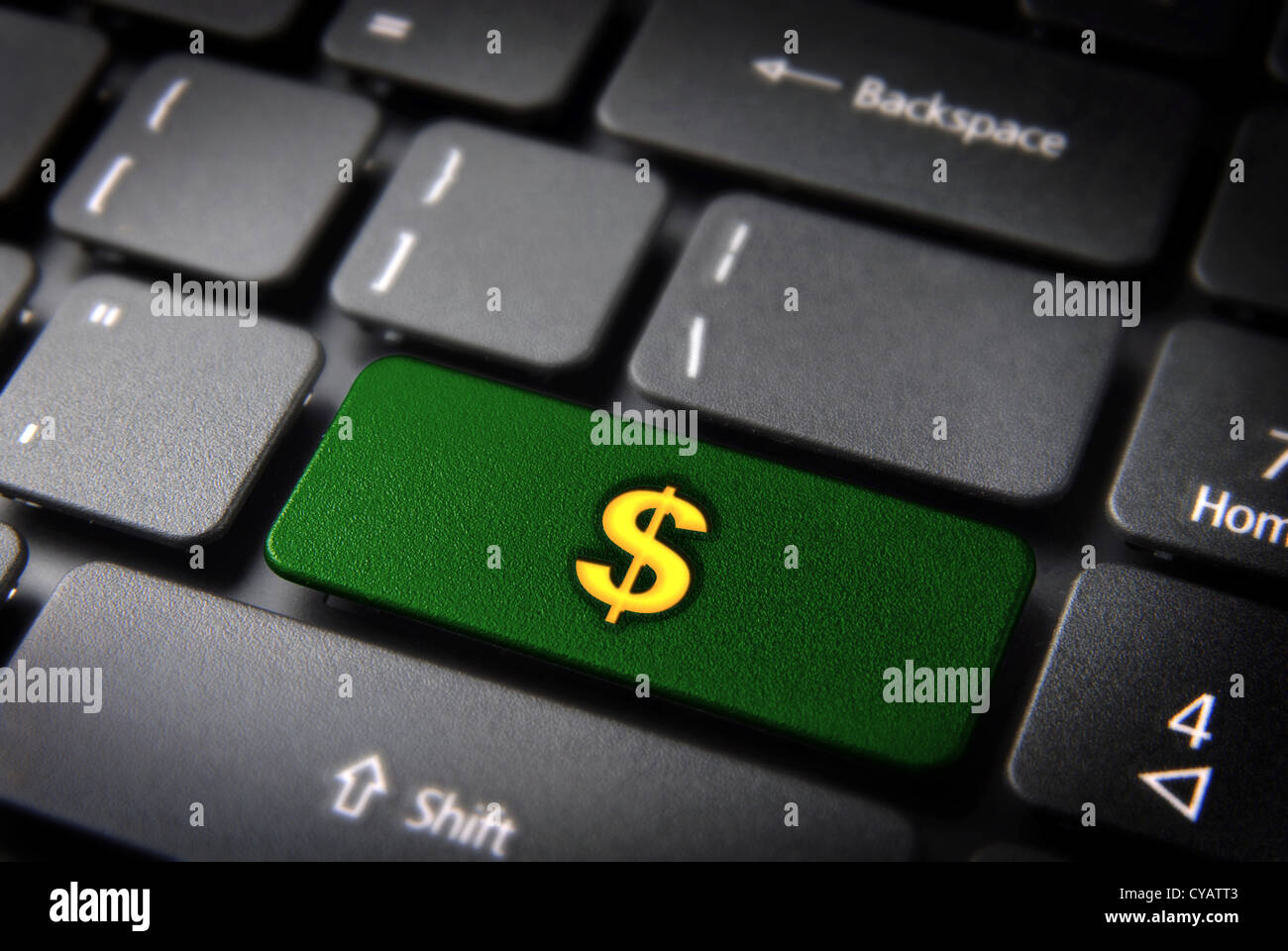 Geld verdienen mit Internet: grüne Taste mit Dollar-Symbol auf Laptop-Tastatur. Im Preis inbegriffen Clipping-Pfad, so dass Sie leicht bearbeitet werden kann Stockfoto
