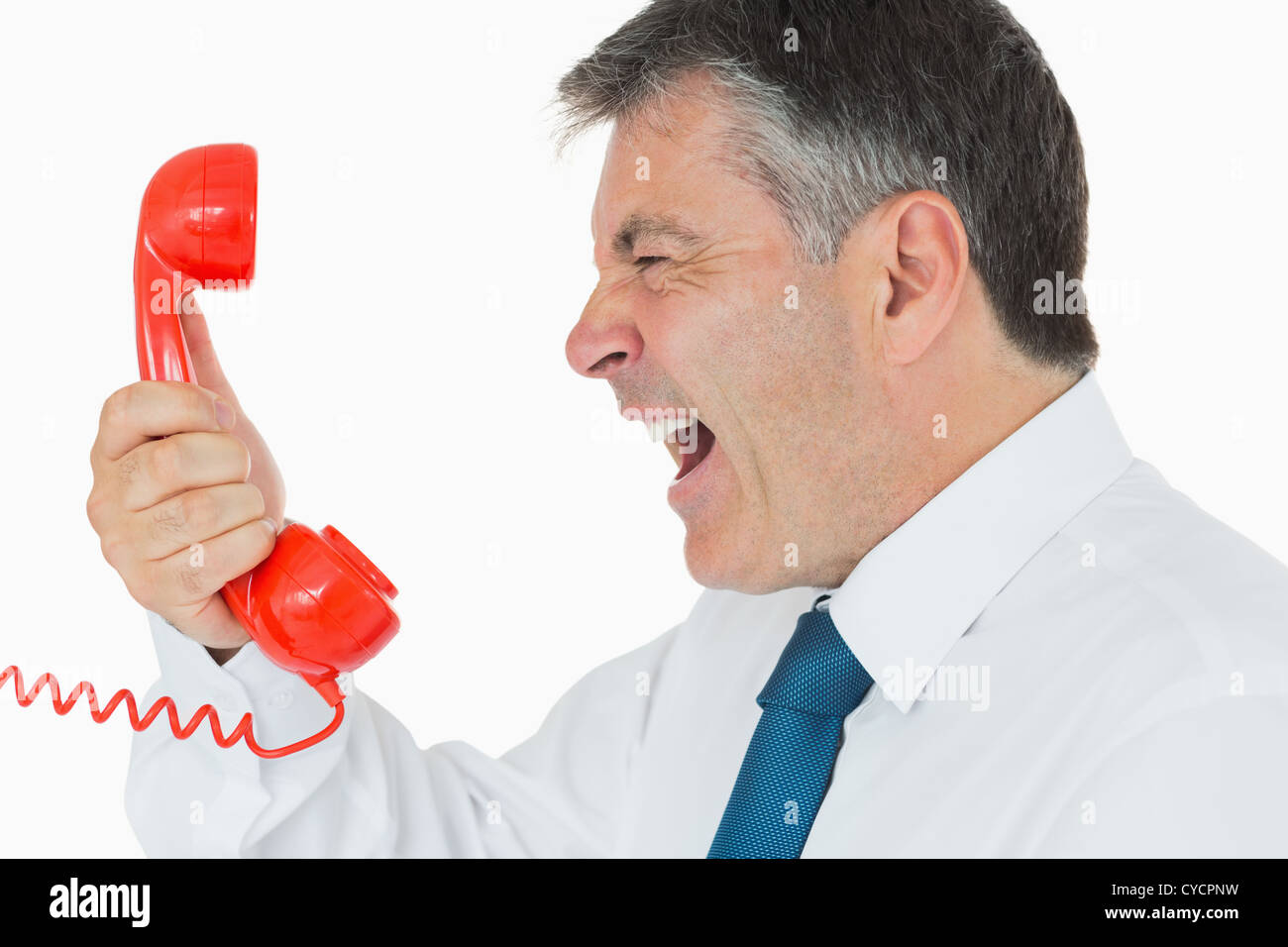 Geschäftsmann in den Telefonhörer schreien Stockfoto