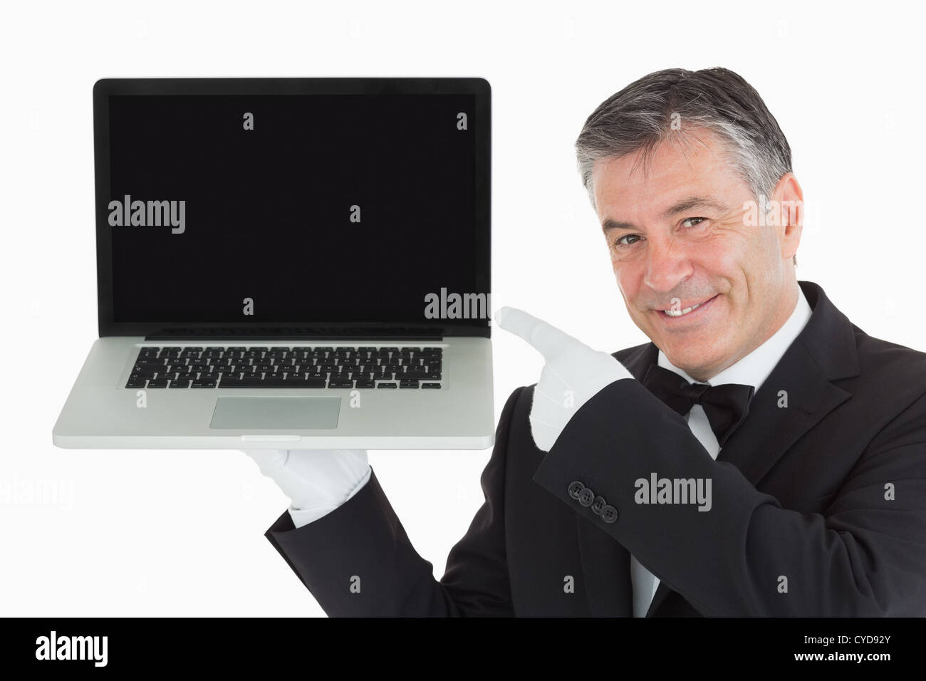 Lächelnden Kellner zeigte uns etwas auf einem laptop Stockfoto