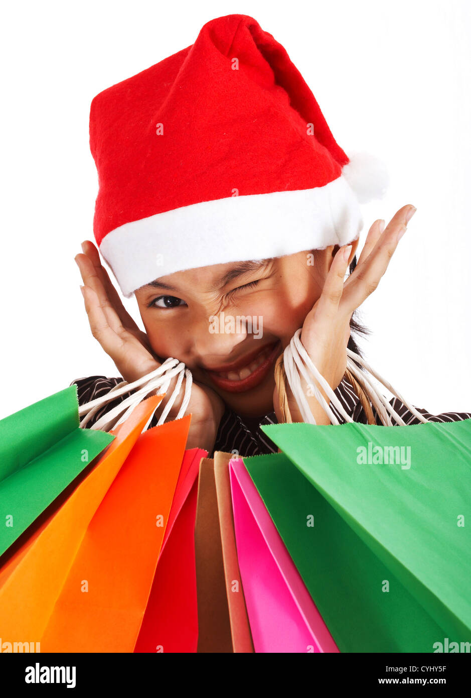 Mädchen nach einem Weihnachts-Shopping Spree viele Geschenke gekauft hat Stockfoto