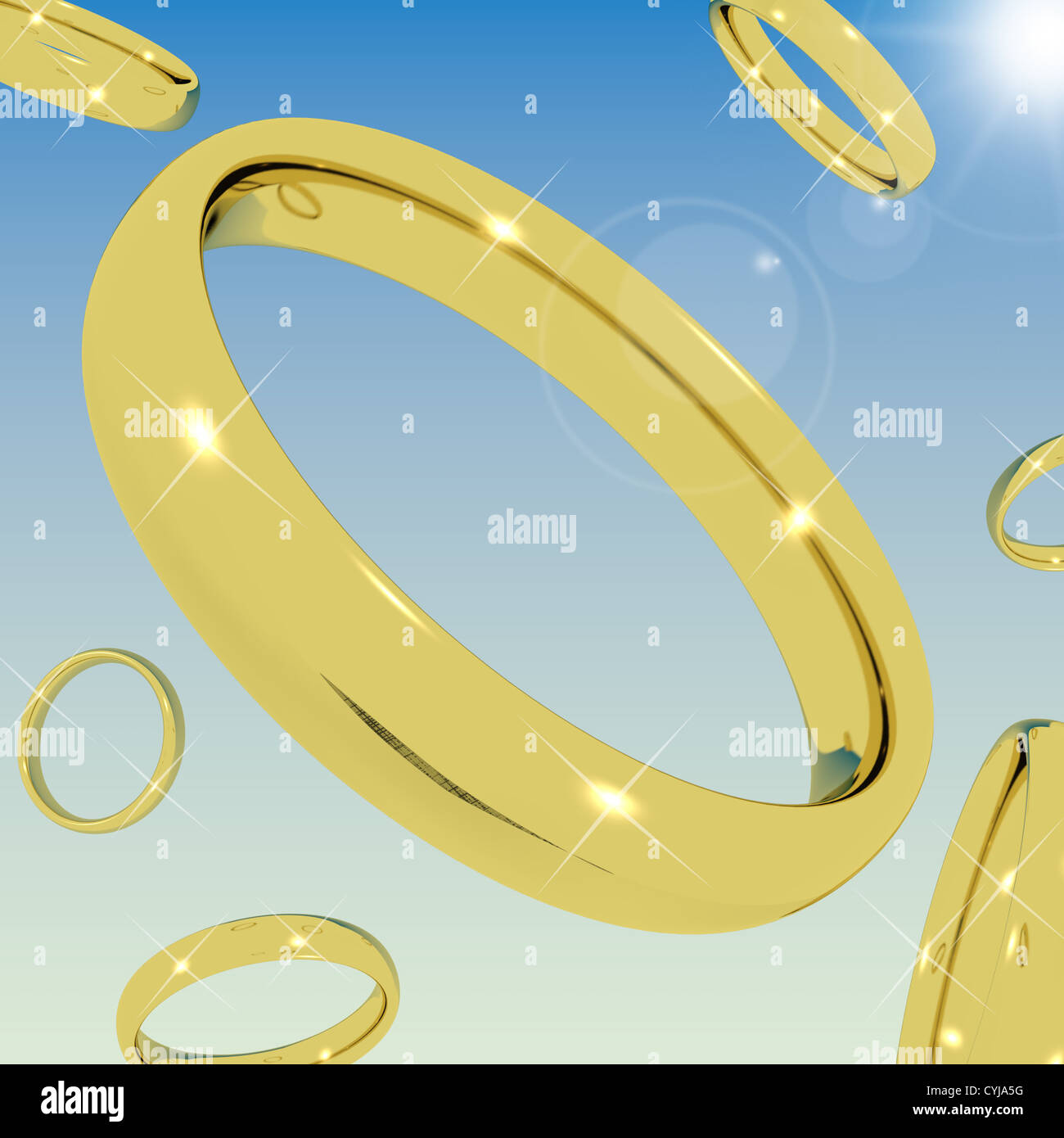 Goldringe vom Himmel repräsentieren Liebe Verlobung oder Ehe Stockfoto
