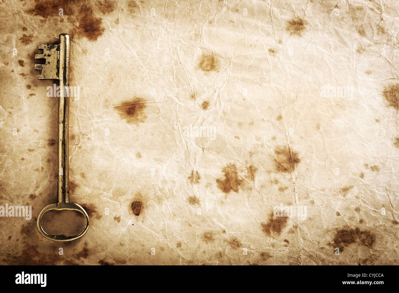 Grunge Hintergrund Papierstruktur mit alten Schlüssel Stockfoto