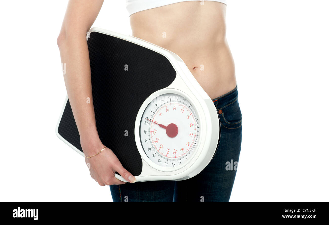 Closeup erschossen, Frau, die Waage. Zugeschnittenes Bild Stockfoto