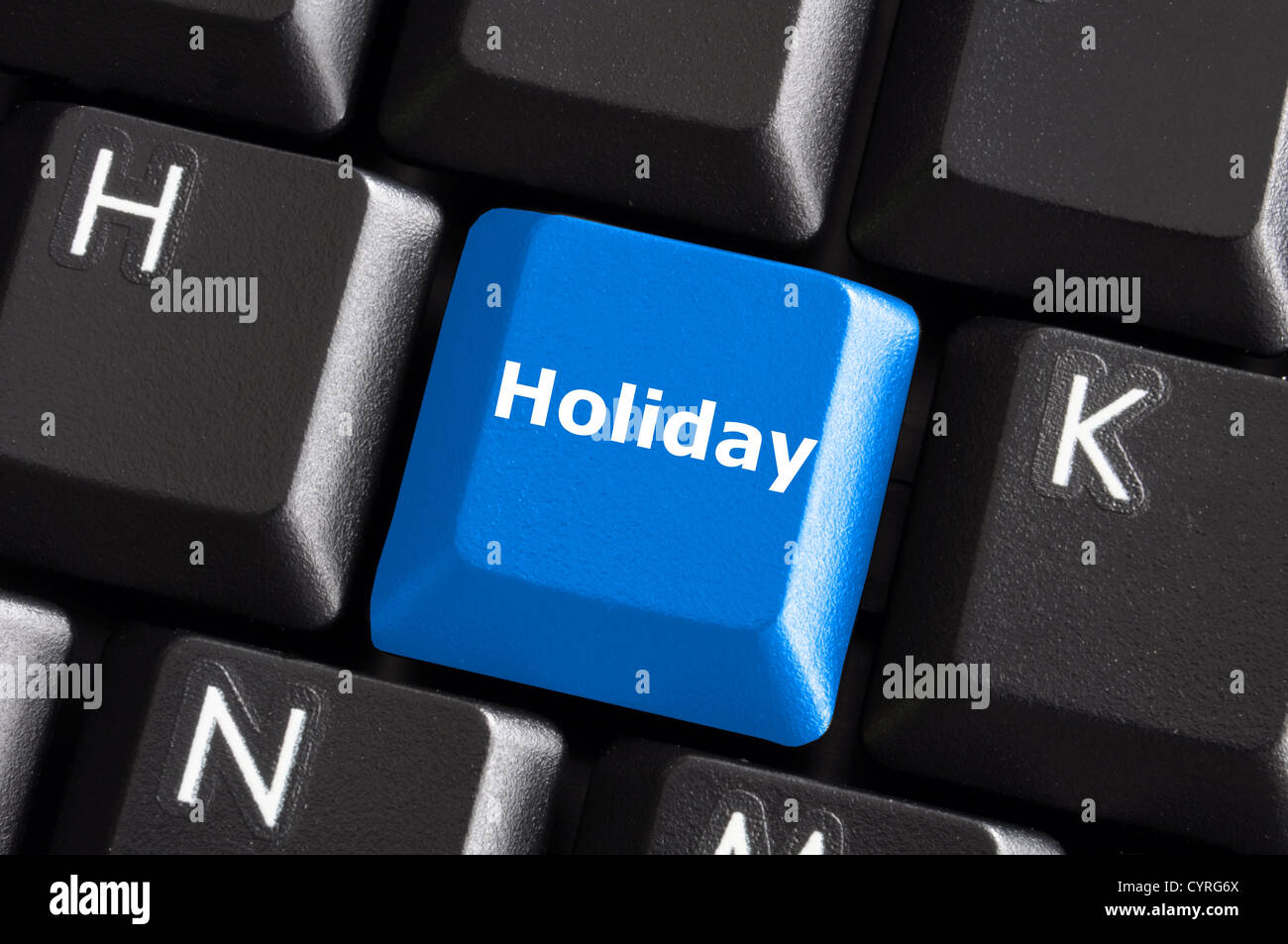 Ferienkonzept mit blaue Taste auf der Computertastatur Stockfoto