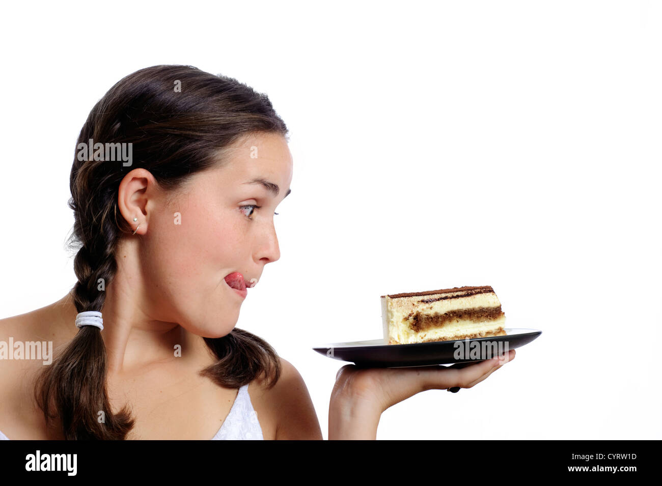 Niedliches Mädchen Augen einen Stück Kuchen Stockfoto