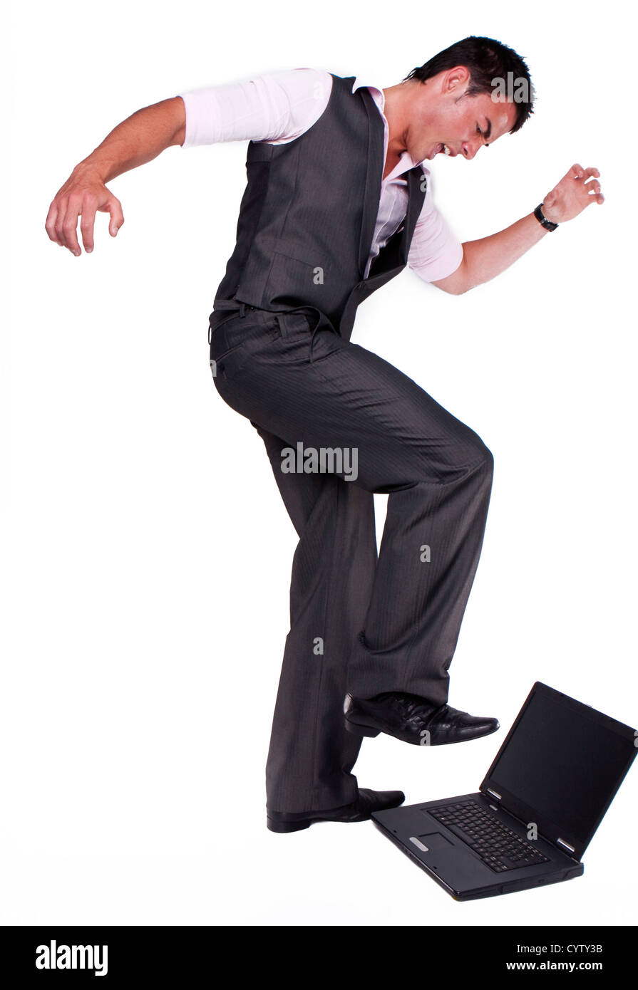 Brünette Geschäftsmann deprimiert Blässe, seinen Laptop zu töten Stockfoto