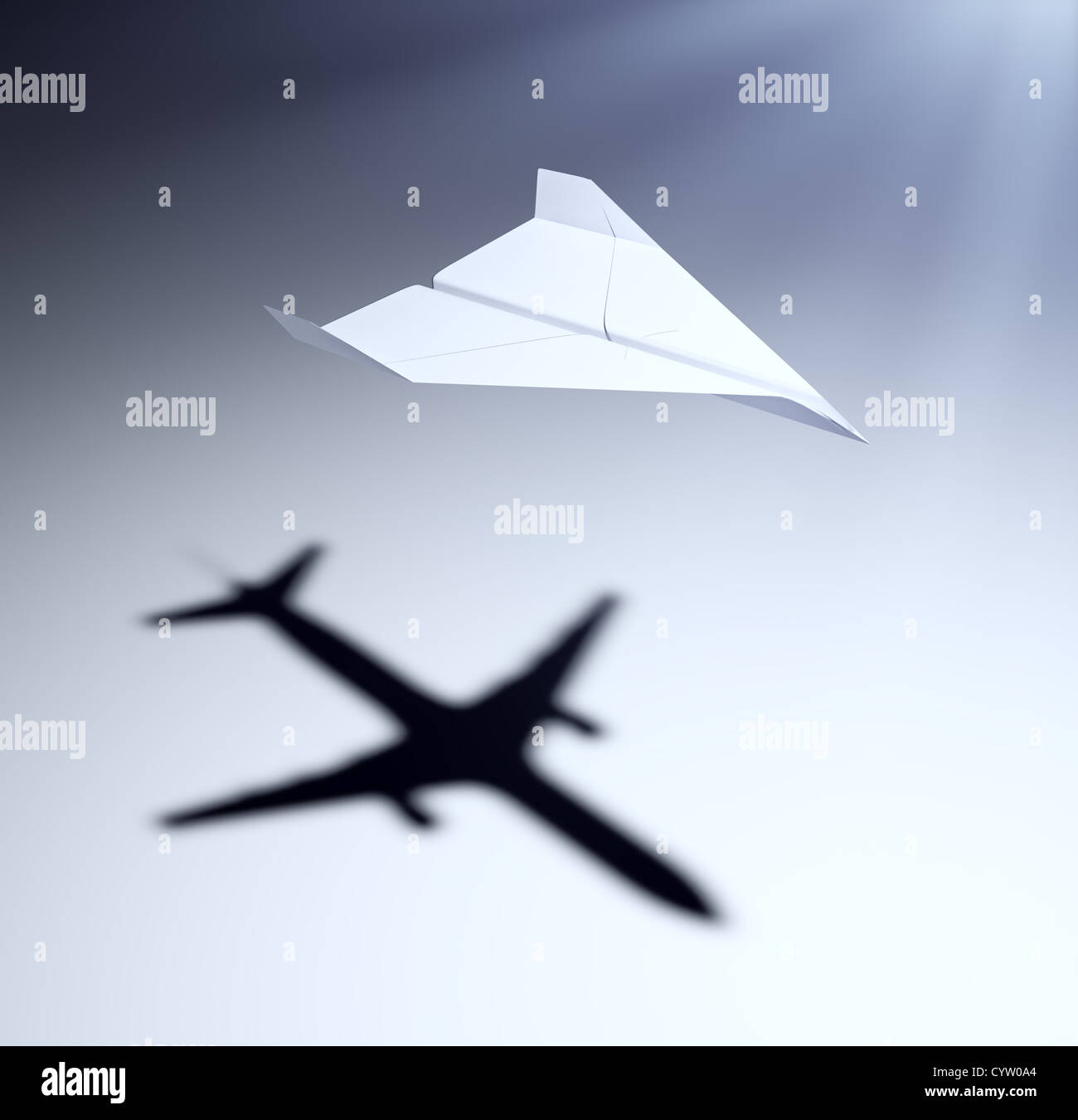 Papierflieger wirft einen Schatten ein Düsenflugzeug - Vision und Ziele Konzept Abbildung Stockfoto