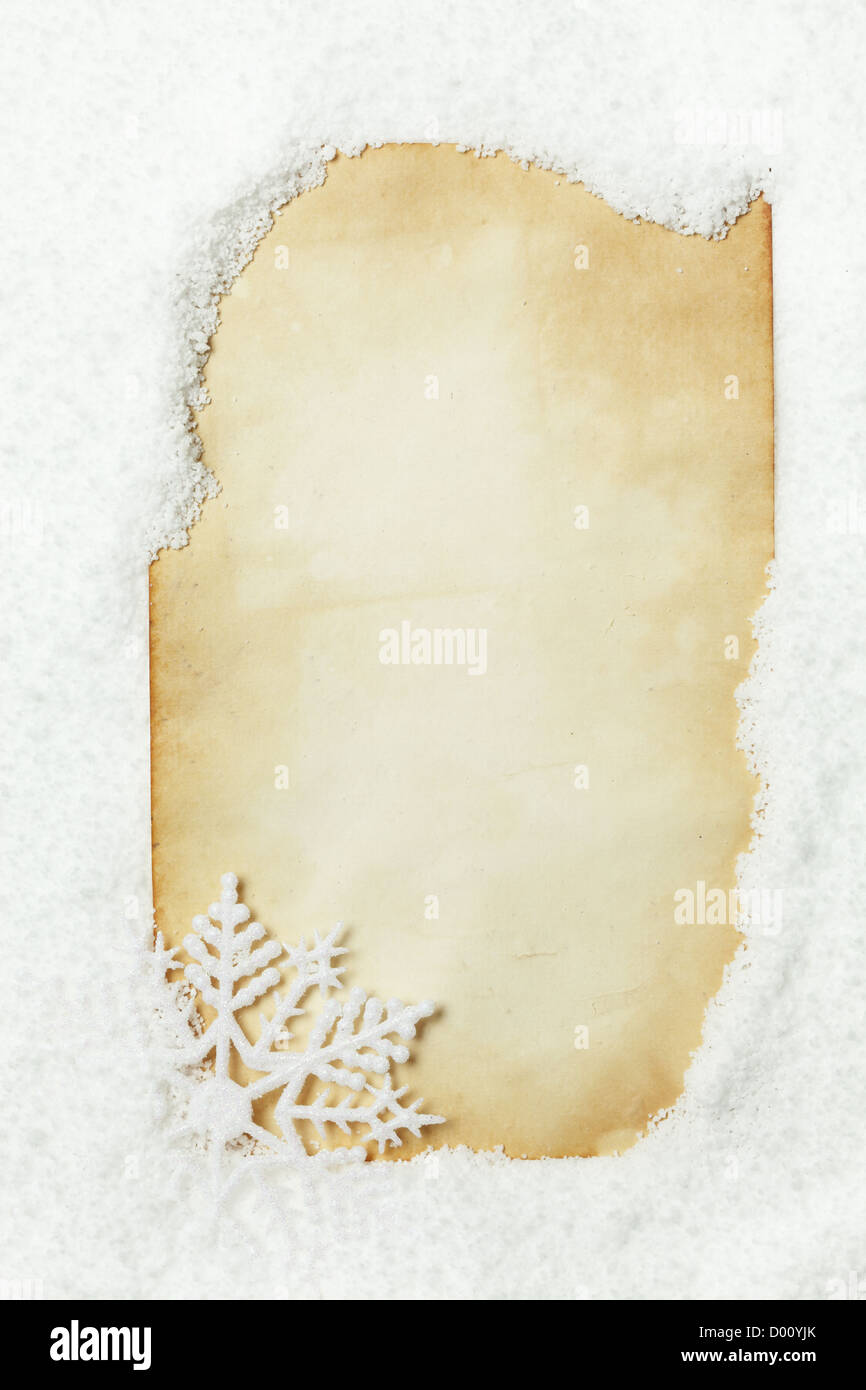 Papier, verschneite mit Schneeflocke Stockfoto