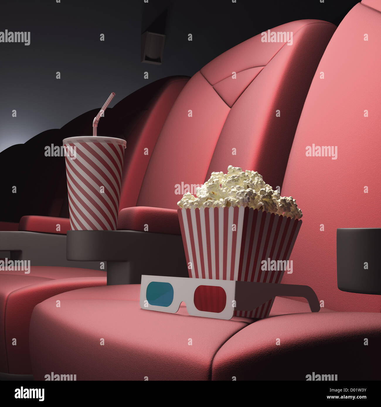 Popcorn, Soda und 3D Brille auf dem Sitz, bereit für den Film. Stockfoto