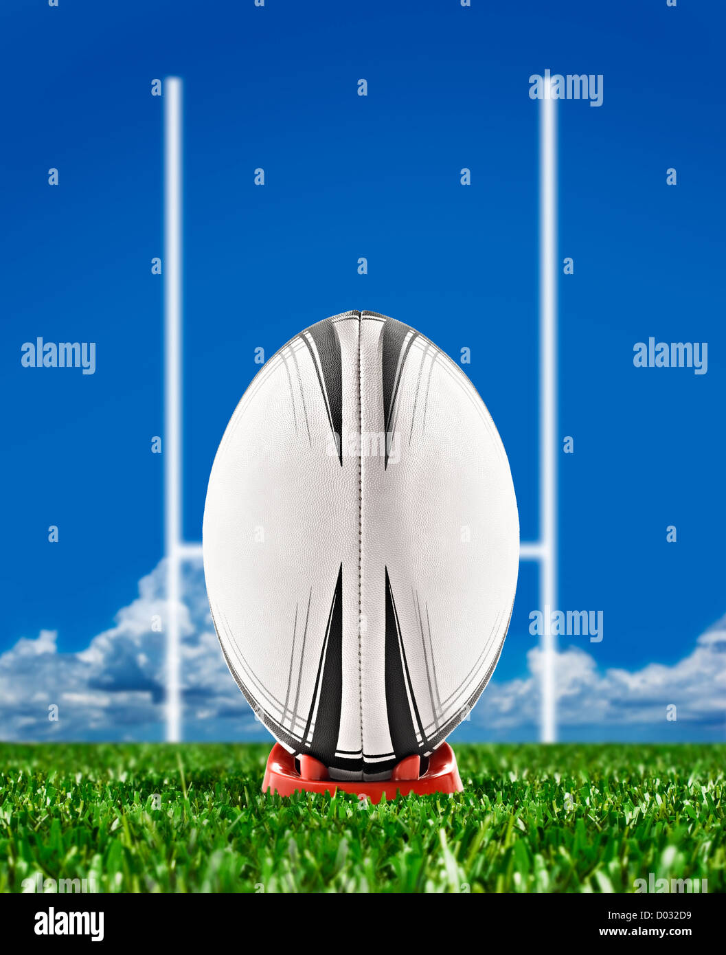 Rugby-Ball mit Torpfosten auf Feld Stockfoto