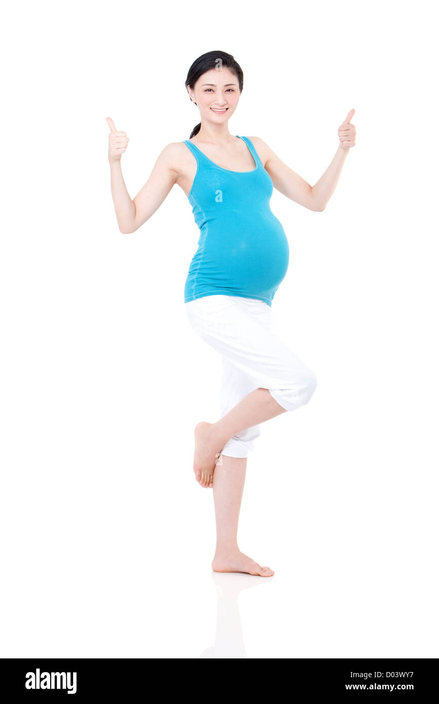 Junge schwangere Frau tun Daumen oben Stockfoto