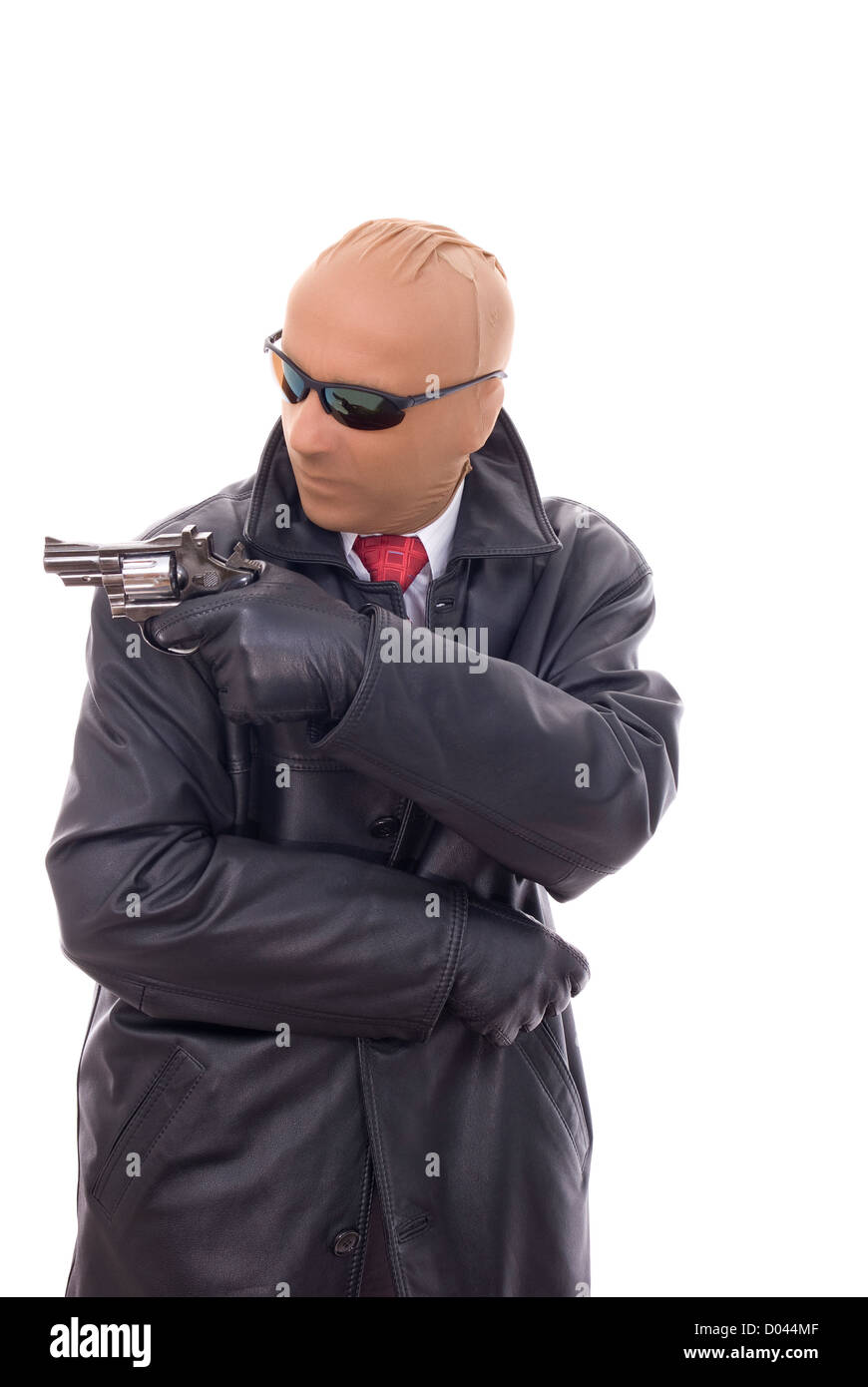 maskierte Bandit in Lederjacke mit Pistole Stockfoto