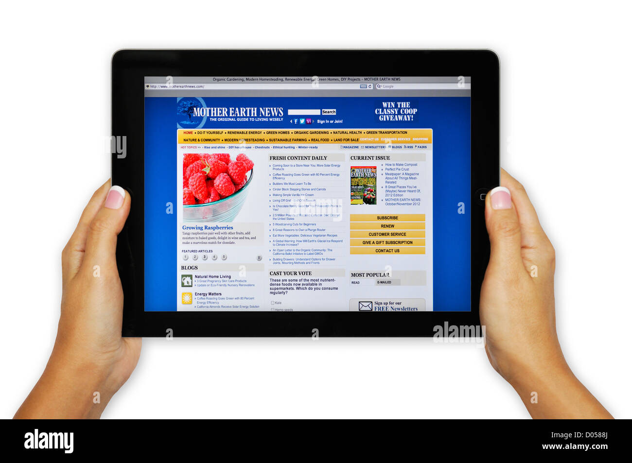 iPad-Bildschirm zeigt Mutter Erde News-Website - Online-Umweltmagazin Stockfoto