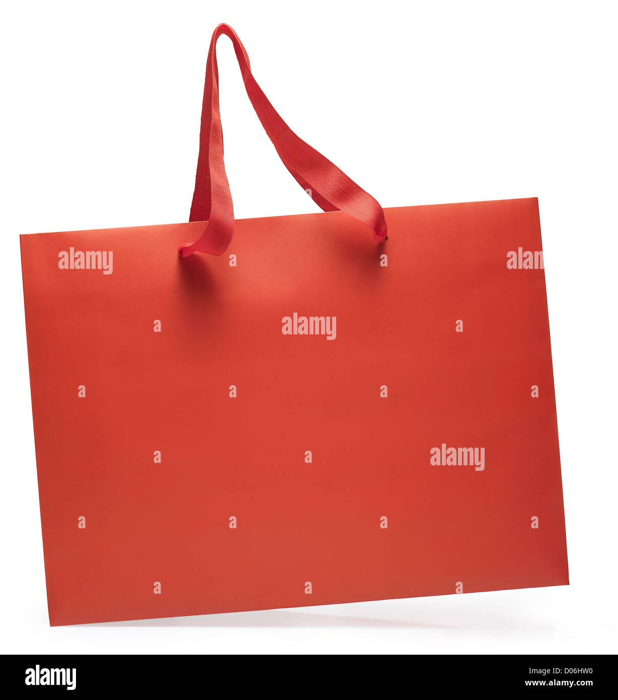 Seitlicher Blick auf eine rote Einkaufstasche in Bewegung. Clipping-Pfad Stockfoto