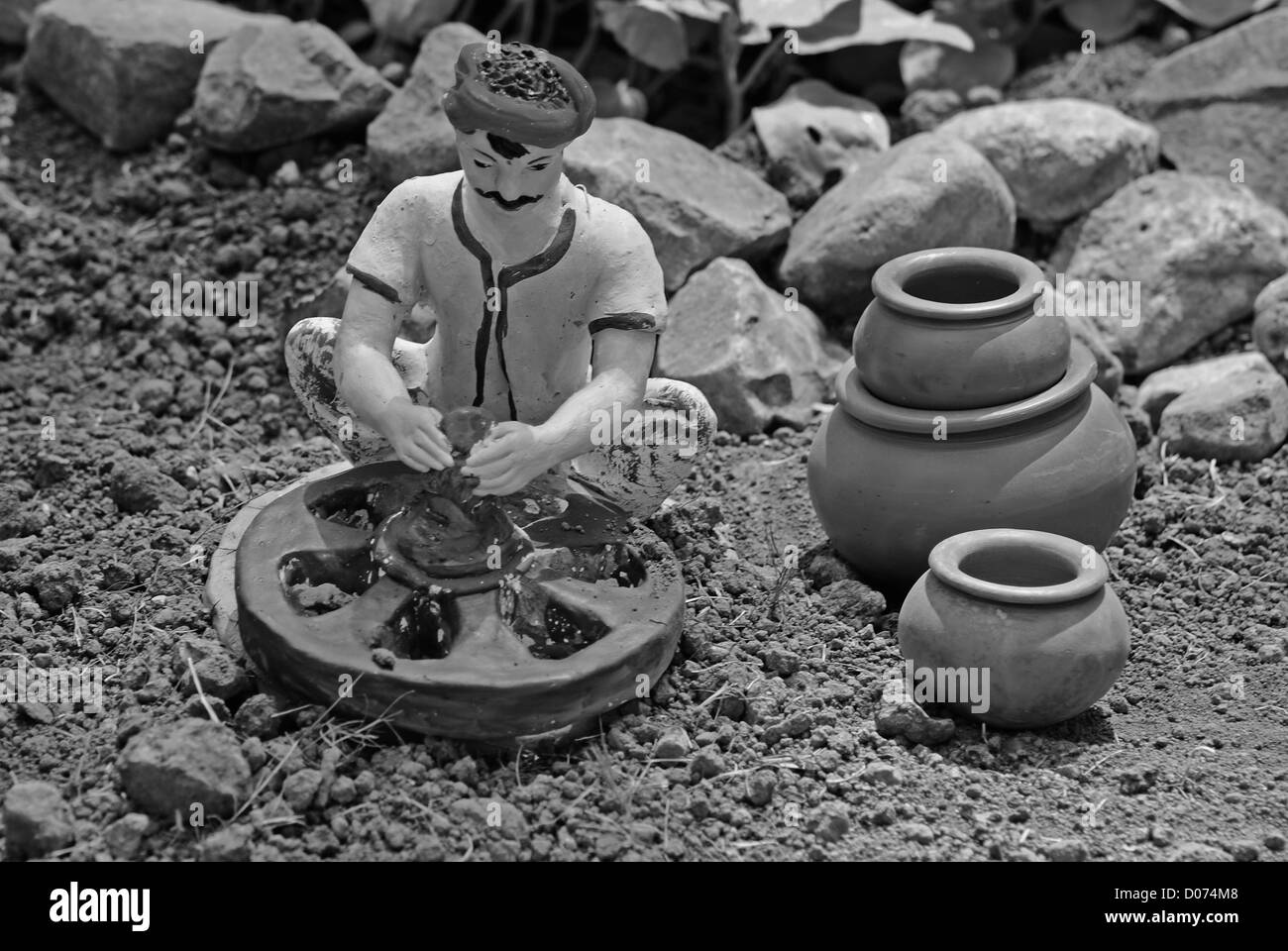 Miniatur-Statue eines Töpfers, Arbeiter Stockfoto