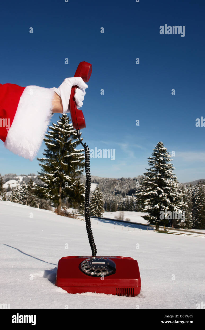 Santa Claus-symbolisiert durch ein rotes Retro-Telefon Hotline Stockfoto