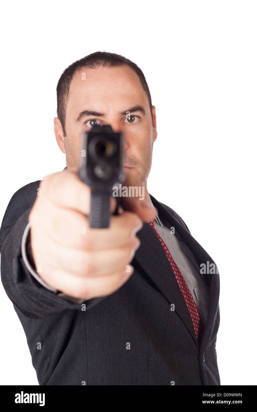 Ernster Mann mit einem Gewehr schussbereit zeigt Ihnen Stockfoto