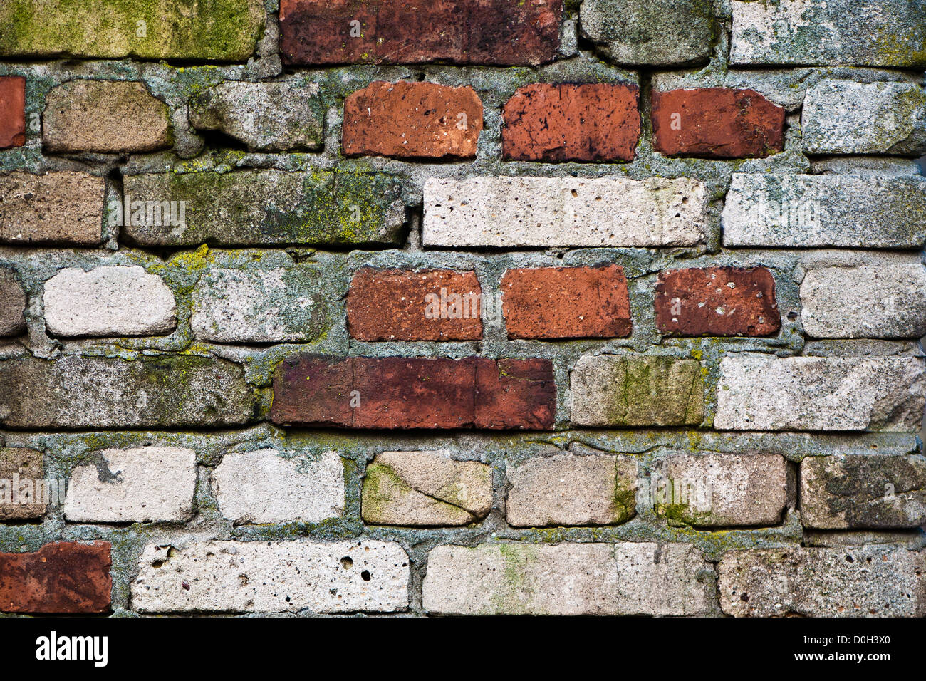 gemauerte Wand - verschiedene Farben Ziegel - Hintergrund Stockfoto