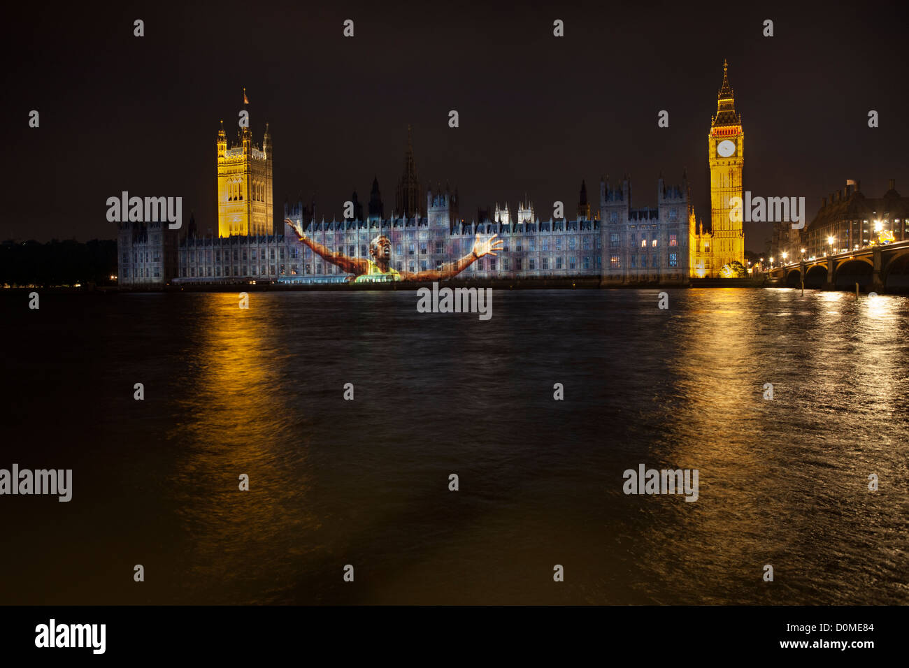 Die Houses of Parliament steigen mit einem Bild von Usain Bolt bei den Olympischen Spielen 2012 in London. Stockfoto