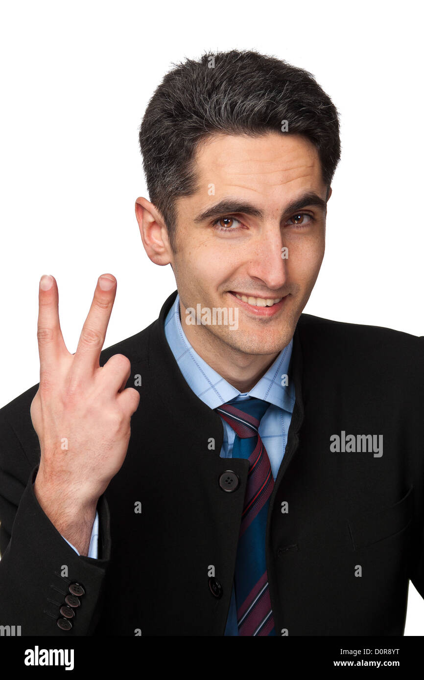 Junger Geschäftsmann zeigt Handzeichen. Stockfoto