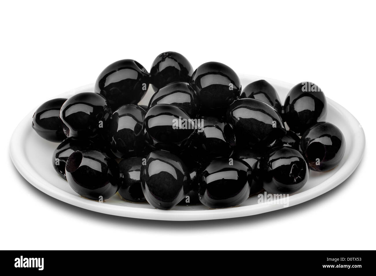 Eingelegte entsteinte schwarze Oliven Stockfoto