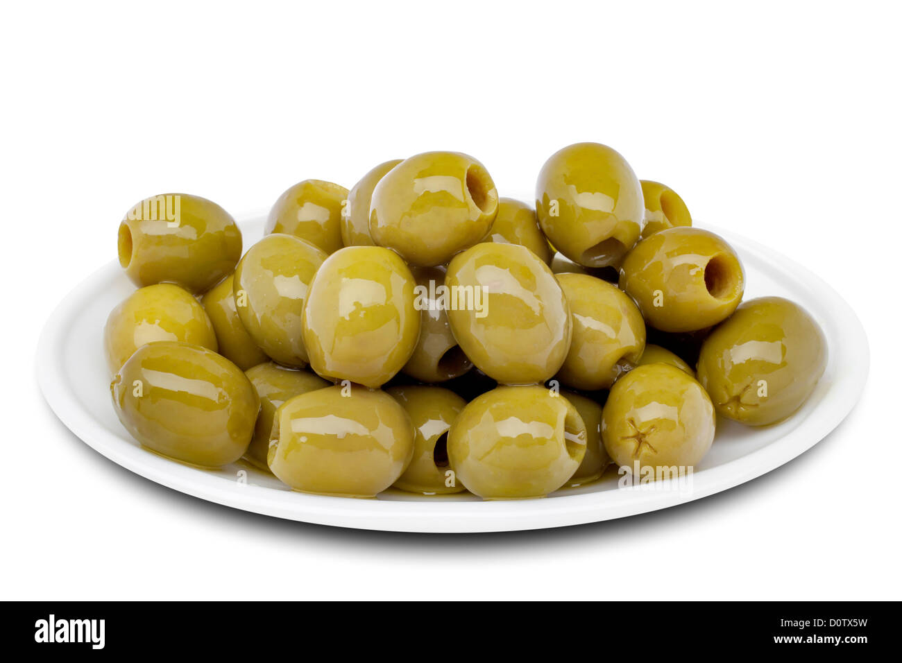 Eingelegte entsteinte grüne Oliven Stockfoto
