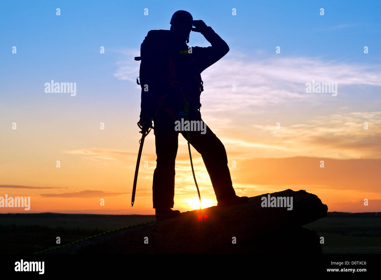 Silhouette-Kletterer Stockfoto