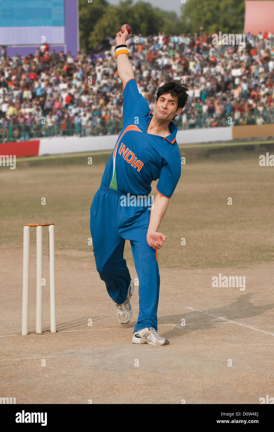 Kricket Bowler in Aktion Stockfoto