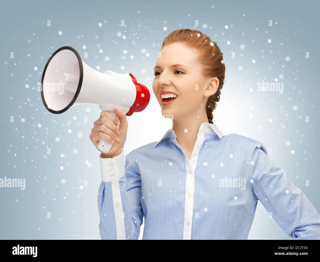 glückliche Frau mit Megaphon Stockfoto