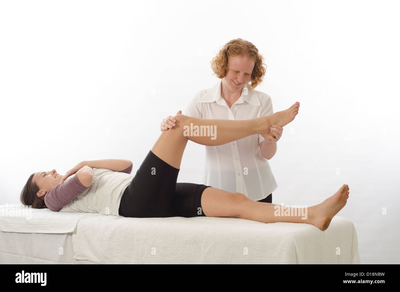 Kinesiologin oder Physiotherapeuten behandeln Piriformis Stockfoto