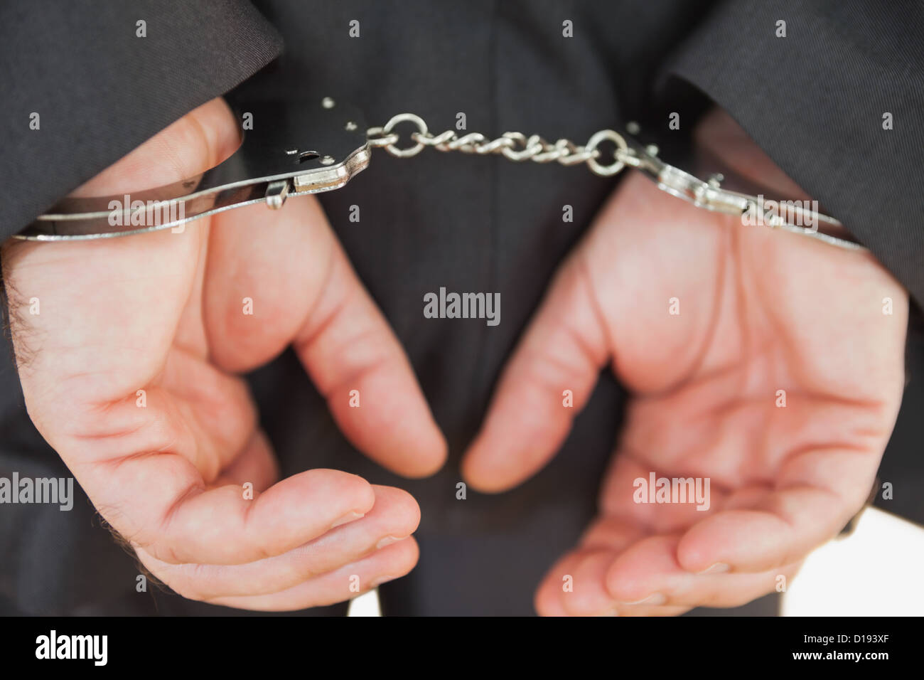 Handschellen-Geschäft Verbrecher Stockfoto