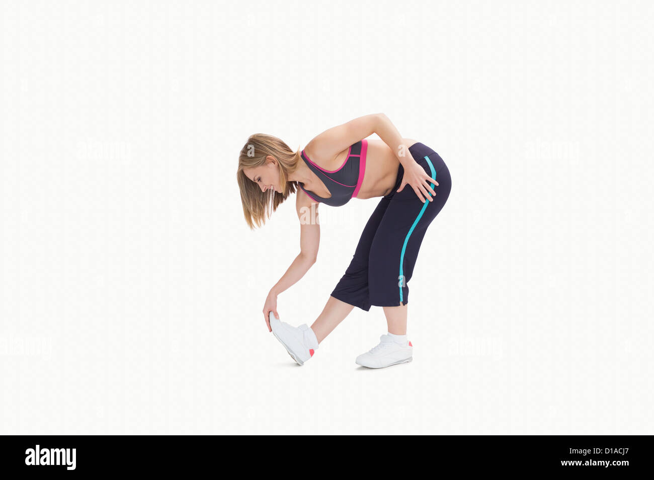 Junge Frau, die stretching-Übung zu tun Stockfoto