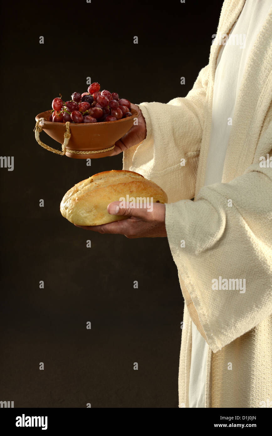 Jesus hält Brot und Trauben Symbole der Gemeinschaft Stockfoto