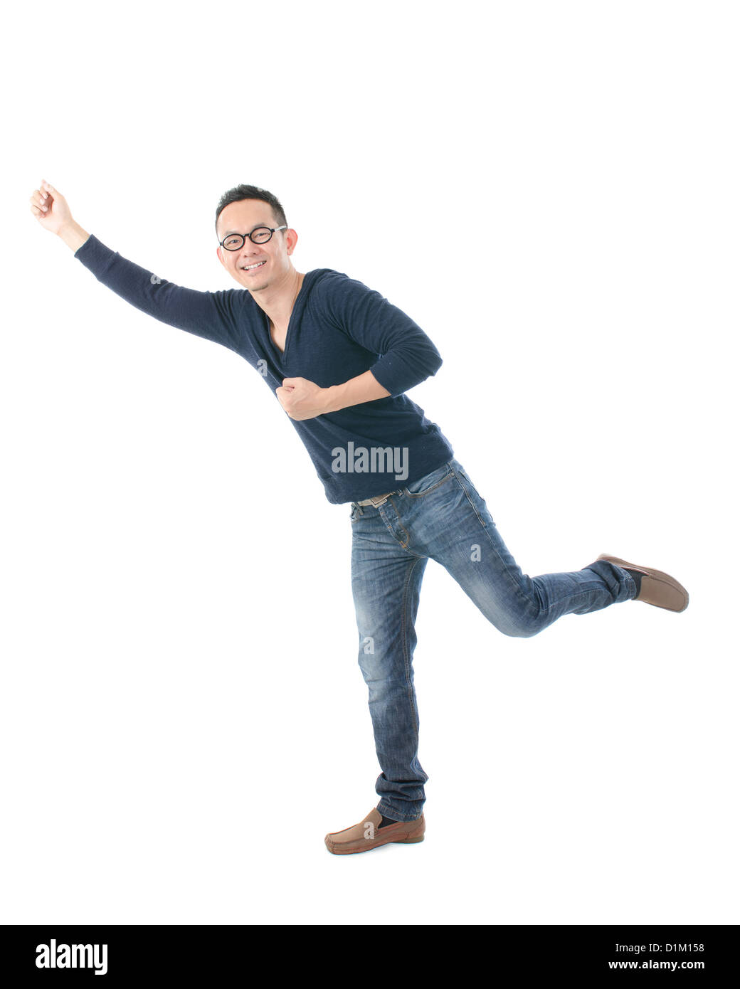 südostasiatischer Mann Celebraing Erfolg Stockfoto