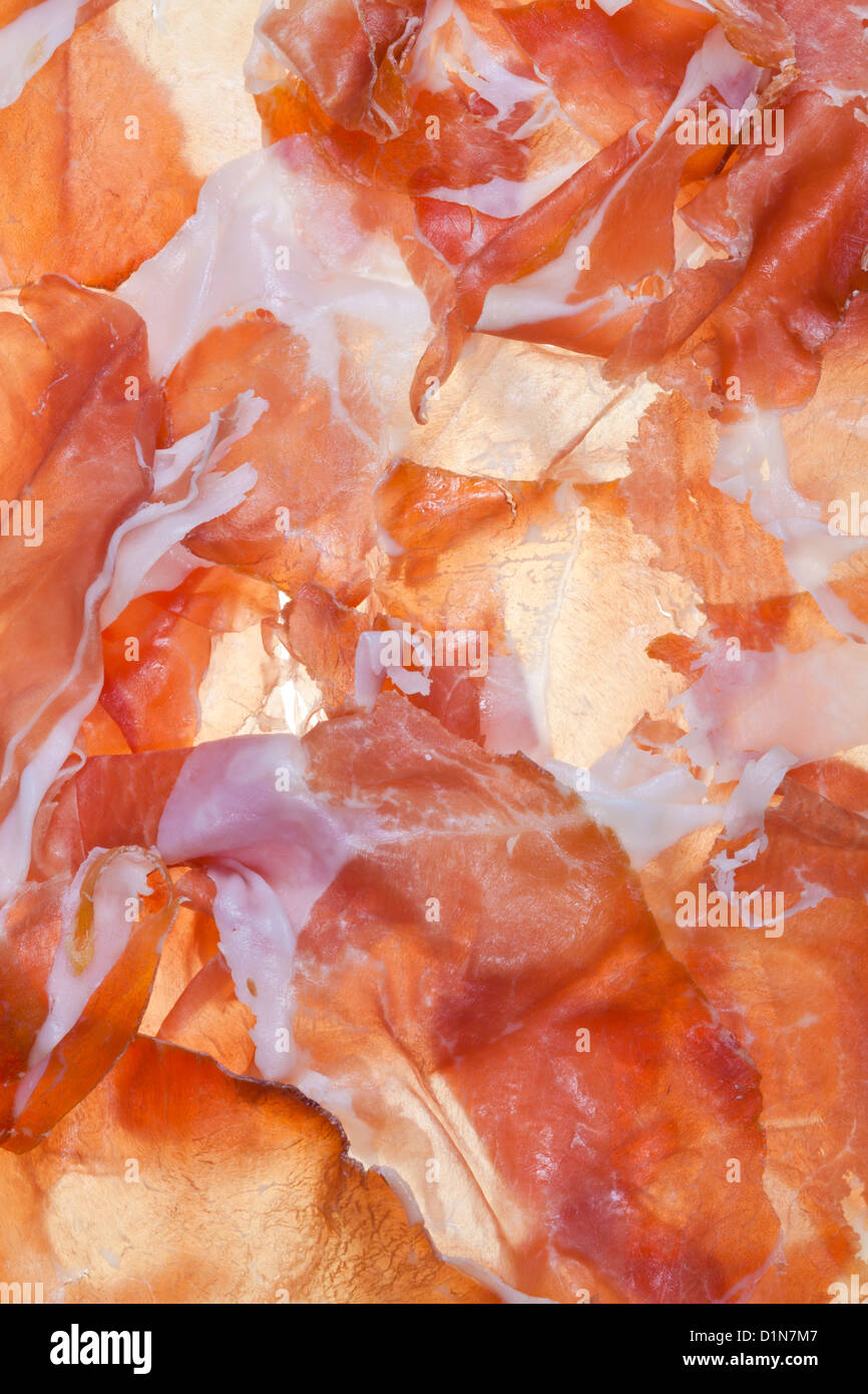 Essen-Hintergrund aus geschnittenen Schinken Prosciutto di Parma hautnah Stockfoto