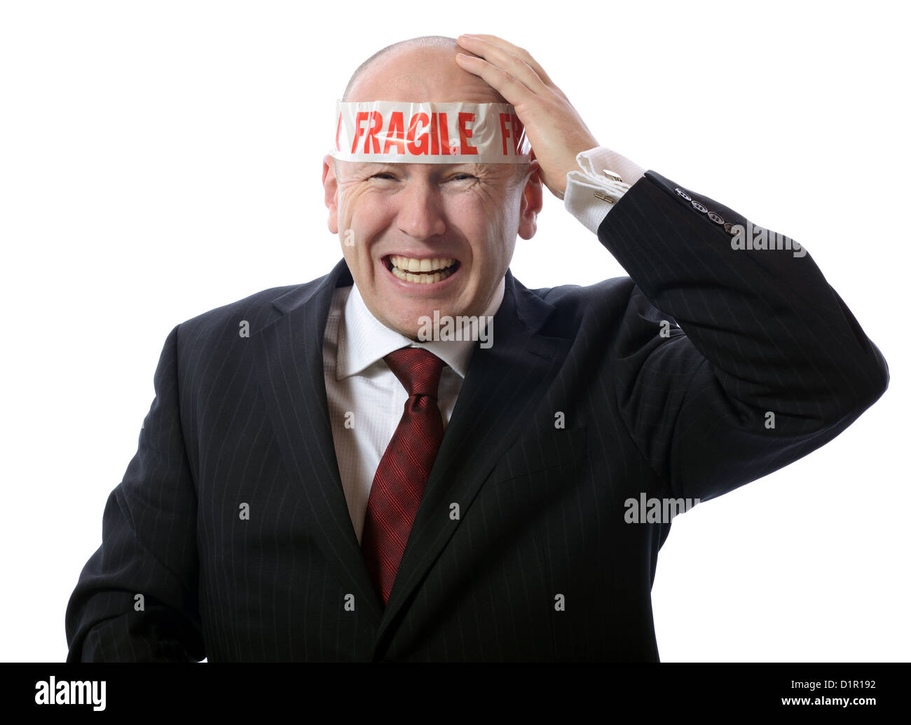 Geschäftsmann mit Stress oder Kopfschmerzen von fragilen Klebeband isoliert auf weiss dargestellt Stockfoto