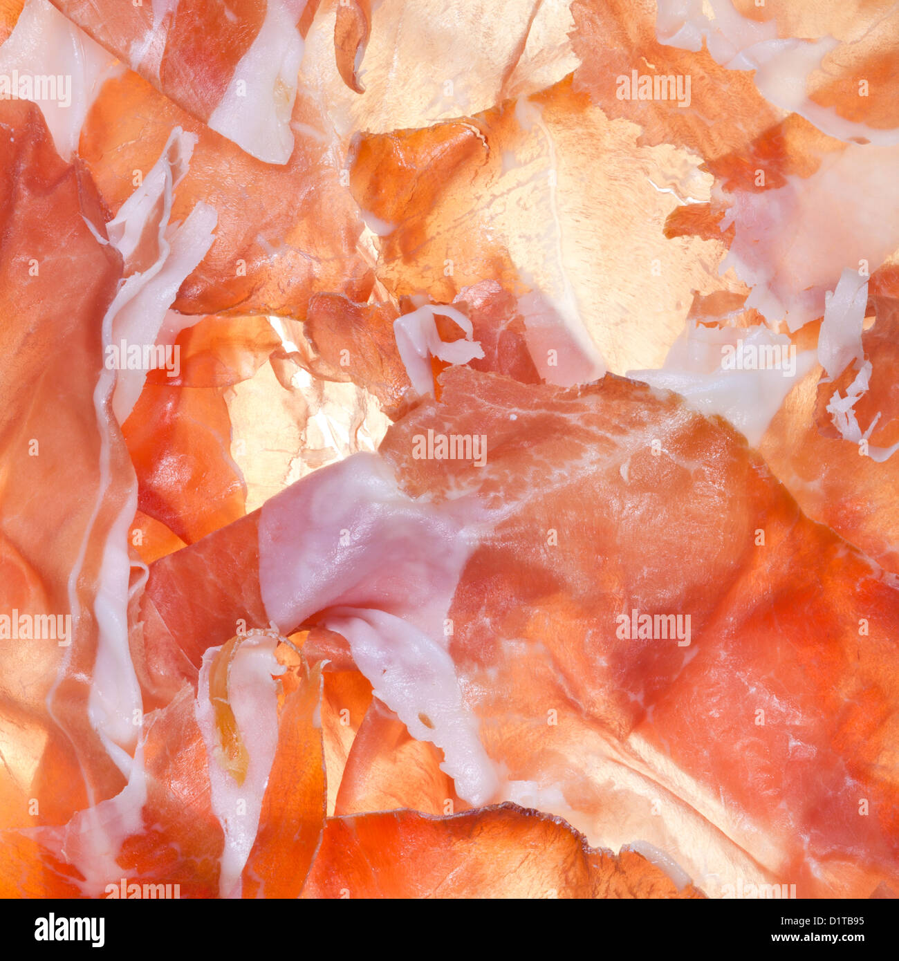 Essen-Hintergrund aus geschnittenen Schinken Prosciutto di Parma hautnah Stockfoto