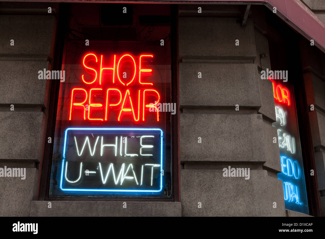 Schuh-Reparatur Shop Leuchtreklame Stockfoto